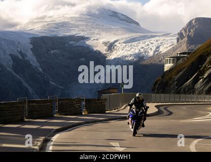 Salzburg, Austria - 30.09.2018: A motorcyclist driving on the Grossglockner high alpine road in Austria Stock Photo