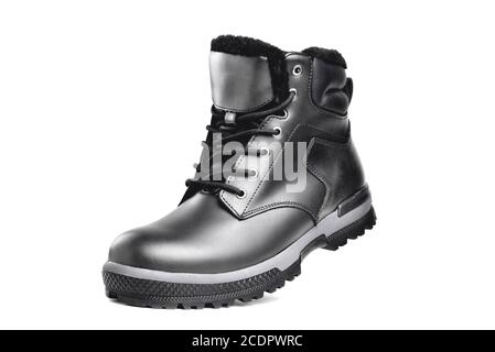 Winter male black leather boot on a white background, hiking shoes, practical off-road shoes, close-up isolate Stock Photo