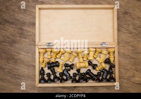 Open chess box with some black and white chess figures inside Stock Photo