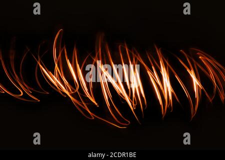Futuristic overlay light pattern.Abstract neon lights trails in the black background.