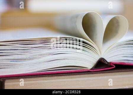 Opened book with heart shaped pages Stock Photo