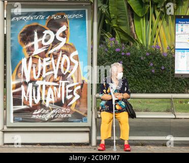 Las Palmas, Gran Canaria, Canary Islands, Spain. 28th August, 2020. People wearing face masks wait for a bus in Las Palmas on Gran Canaria. The Canary Islands have seen a huge spike in Coronavirus infections in August, with Las Palmas registering the most cases. Credit: Alan Dawson/Alamy Live News Stock Photo