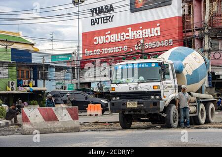 SAMUT PRAKAN, THAILAND, JUL 28 2020, A truck with a concrete mixer stands on a reconstructed road in the city. Stock Photo
