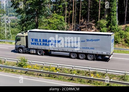 Tillmann Wellpappe Mercedes-Benz Actros truck with curtainside trailer on motorway. Stock Photo