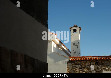 Paint peels off a chimney on a home in rural Croatia. Stock Photo