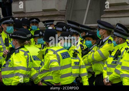 London, UK. 29th Aug, 2020. A large police presence guarded Downing Street from the large anti vaxx protest that marched from Trafalgar Square London UK Credit: Ian Davidson/Alamy Live News Stock Photo
