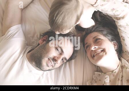family in the privacy of the bedroom II Stock Photo