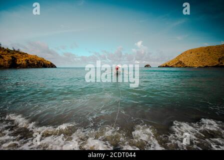 Lone boat at the shore of the beach at Zambales, Philippines. Stock Photo