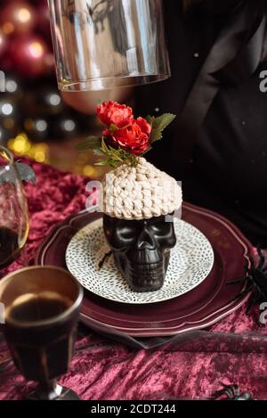 Artificial skull with knitted brains. Halloween decorations. Stock Photo