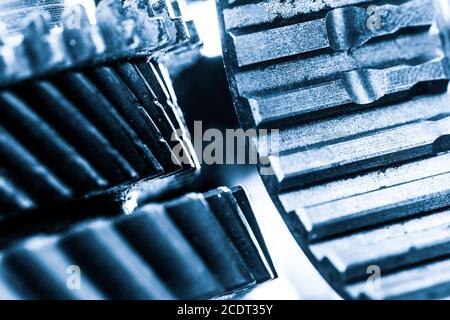 Gears, grunge cogwheels, real engine elements close-up. Heavy industry Stock Photo