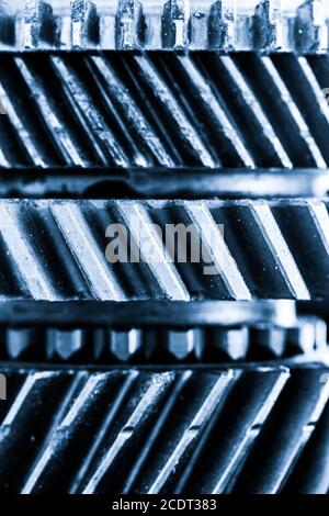 Gears, grunge cogwheels, real engine elements background. Heavy industry Stock Photo