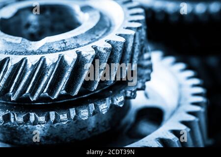 Gears, grunge cogwheels, real engine elements close-up. Heavy industry Stock Photo
