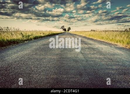 Empty straight long asphalt road. Concepts of travel, adventure, destination, transport etc. Stock Photo