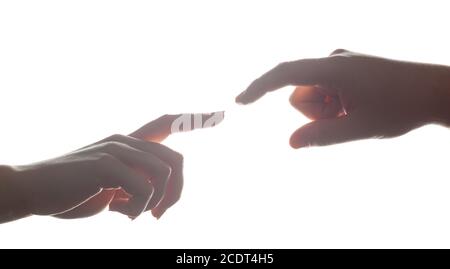 Man#39;s and woman#39;s hands, fingers reaching each other. Love, connect, help concepts. Stock Photo