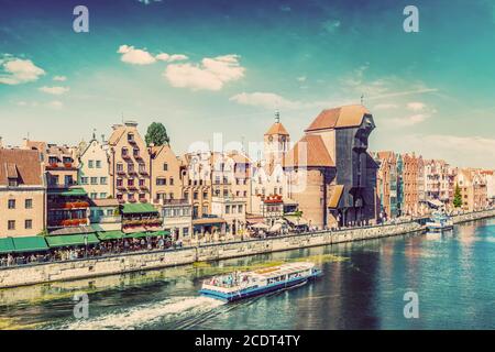 Gdansk old town and famous crane, Polish Zuraw. Motlawa river in Poland. Vintage Stock Photo