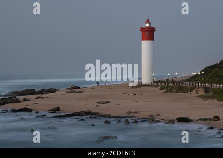 Beautiful lighthouse on Umhlanga Rocks beach, landscape, Durban, South Africa, seaside, motion blur, promenade, scenic seascape, building, sea, coast Stock Photo