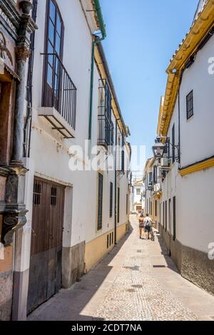 Cordoba, Spain - June 20 : A lone couple walking on the streets of Cordoba on June 20, 2017. Stock Photo