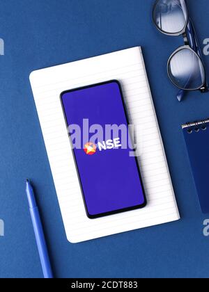 Assam, india - August 27, 2020 : NSE logo on phone screen stock image. Stock Photo