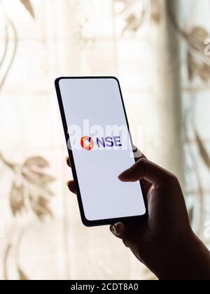 Assam, india - August 27, 2020 : NSE logo on phone screen stock image. Stock Photo