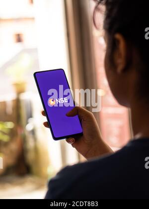 Assam, india - August 27, 2020 : NSE logo on phone screen stock image. Stock Photo