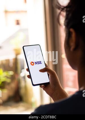 Assam, india - August 27, 2020 : NSE logo on phone screen stock image. Stock Photo