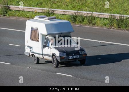 Black white 1995 Citroën C 15D mobile home; Caravans and Motorhomes, campervans on Britain's roads, RV leisure vehicle, family holidays, caravanette vacations, Touring caravan holiday, van conversions, Vanagon autohome, life on the road, dormobile driving on M6 motorway UK Stock Photo