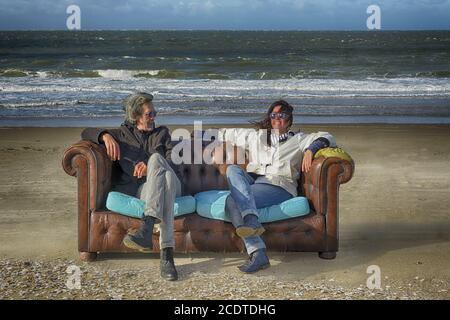 sitting on the beach Stock Photo