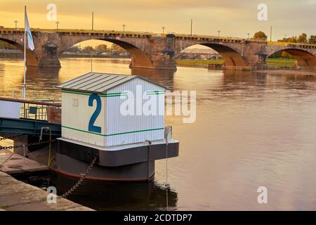 Pier for excursion boats on the banks of the Elbe in Dresden at sunset Stock Photo