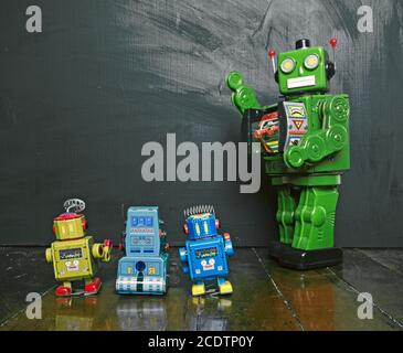 Big green robot toy teaches his class , Stock Photo