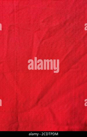 Texture of red nylon fabric - aviation tarpaulin close up Stock Photo