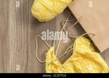 wooden knitting needles on background of grey merino wool blanket Stock  Photo - Alamy