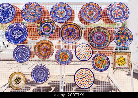 Hanging colorful painted clay scales Stock Photo