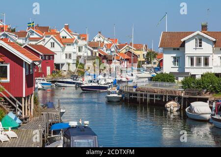 Cottages and boats on the canal in an old fishing village Stock Photo