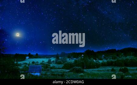 Summer rural night with full moon and shimmering stars on sky Stock Photo