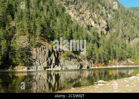 The rocky cliffs reflected in Crown Lake in Marble Canyon Provincial Park, British Columbia, Canada Stock Photo