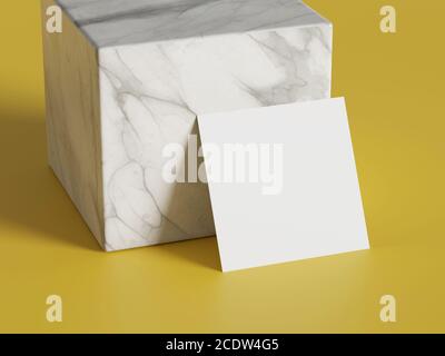 White square shape paper mockup on yellow gold isolated background with marble stone cube. Branding presentation template print. 3D illustration rende Stock Photo