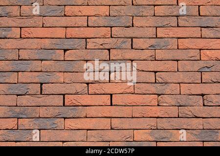 Background brick wall without cement joints Stock Photo