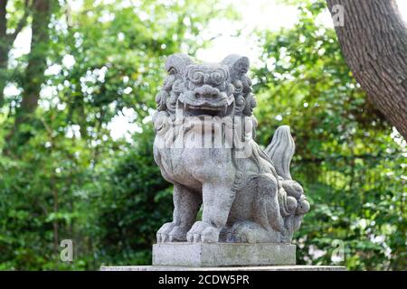 Japanese stone lion statue in Nanba Yasaka Shrine . Stock Photo