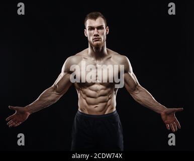 Agressive Bodybuilder Aggressive man is a fighter, a bodybuilder on a black Stock Photo - Alamy