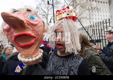 Anti Brexit protesters having a Mad Hatters Tea Party from the book Alice in Wonderland with a Boris Johnson look-a-like, outside Downing Street, protesting todays announcement of the start Article 50, the formal start of the 2 year process for Britain to leave the European Union.  Downing Street, Whitehall, London, UK.  29 Mar 2017 Stock Photo