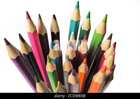 A set of colored pencils in a glass top view closeup on white background Stock Photo