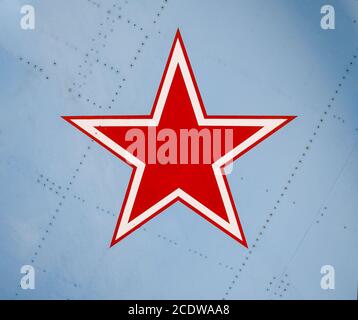 Five-pointed red star on the wing skin of a military fighter Stock Photo