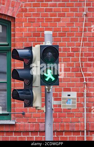 Pedestrian light shows green, so you can go Stock Photo