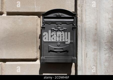 Old Italian mailbox on the wall. Cassetta per le lettere means letterbox, Regie poste means royal post. Stock Photo