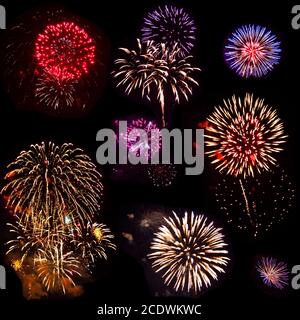 Colorful set of eight exploded fireworks, isolated on black background Stock Photo