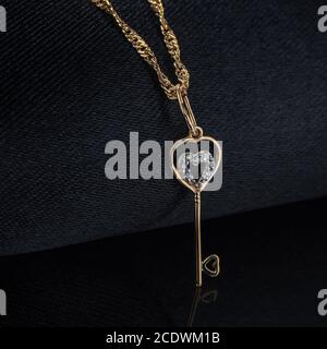 Decoration pendant in the form of a key on a chain Stock Photo