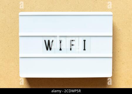 Lightbox with word wifi on wood background Stock Photo
