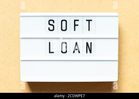 Lightbox with word soft loan on wood background Stock Photo