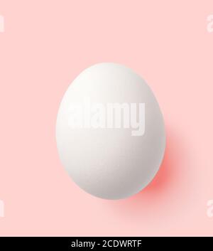 white egg isolated on pink with clipping path Stock Photo