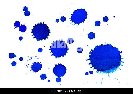 Collection of small and large blue dried ink spots or inkblots on white paper Stock Photo